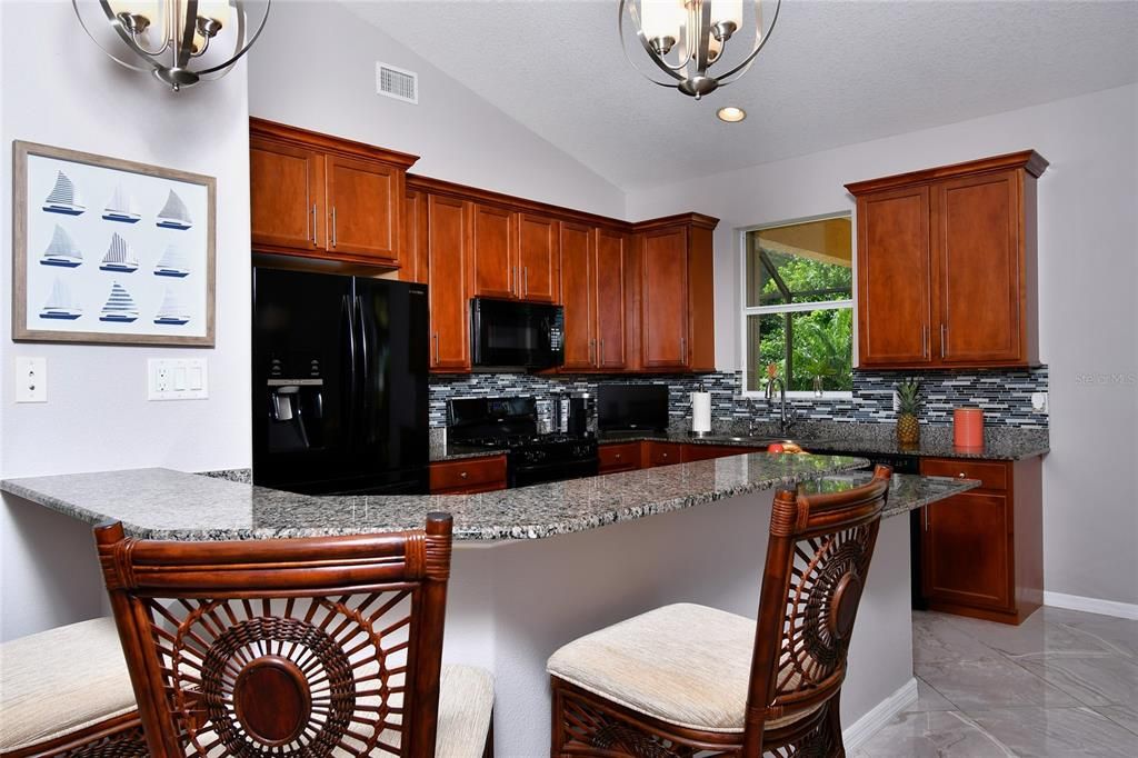 Elegant granite counters compliments the kitchen