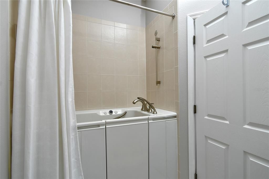 Kohler jetted walk-in tub & shower in bathroom two.