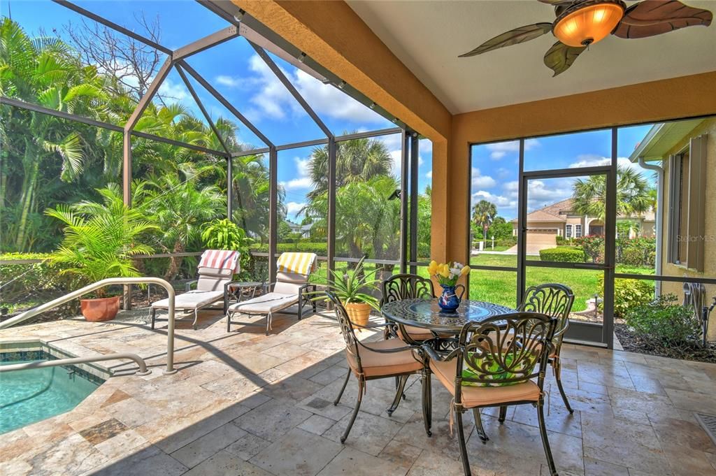 Outside dining is delightful in this screen lanai area