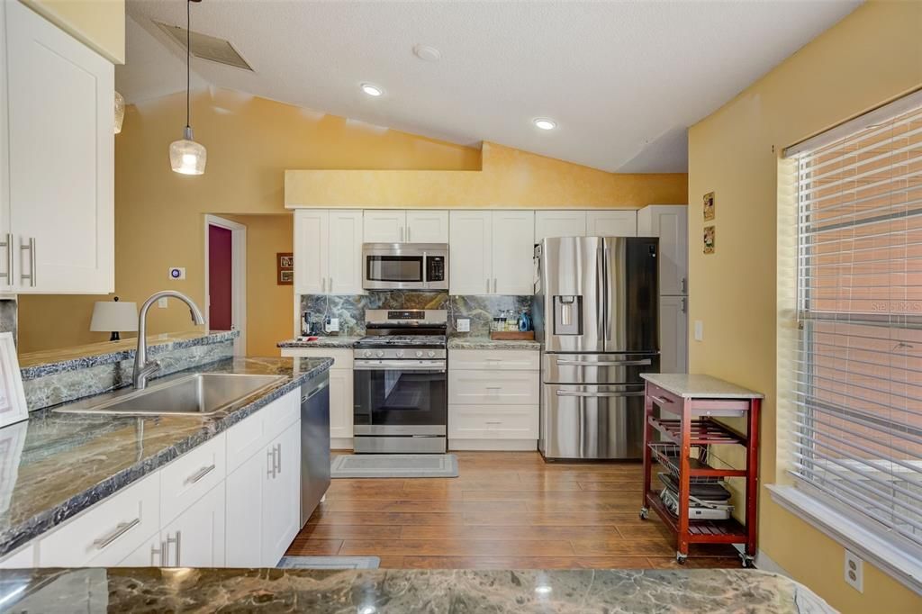 the KITCHEN was RENOVATED with NEW CABINETS, REFINISHED COUNTERTOPS, and BRAND-NEW STAINLESS-STEEL APPLIANCES INCLUDING A GAS RANGE for your CLEAN COOKING NEEDS!!