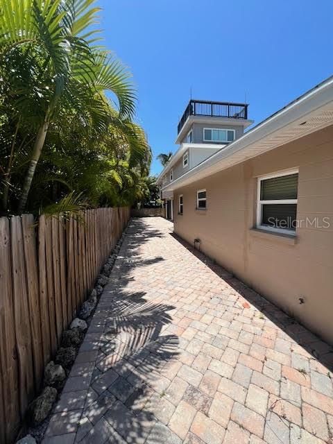 Side Driveway for Extra Parking and Entry to Upstairs Units