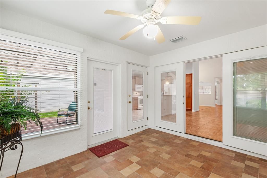 BONUS/FLORIDA ROOM WITH VIEW TOWARDS PATIO AREA AND FAMILY ROOM TO THE RIGHT