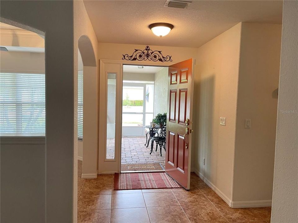 FOYER AREA WITH VIEW TOWARDS SCREENED IN FRONT PORCH