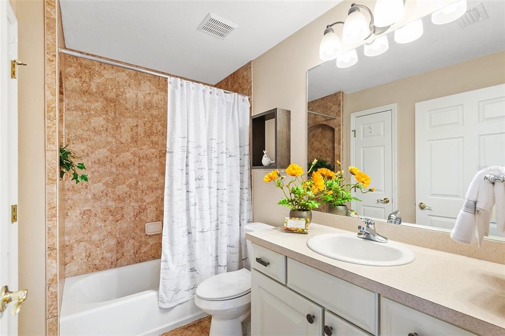 SPACIOUS GUEST BATHROOM. LINEN CLOSET TO THE LEFT