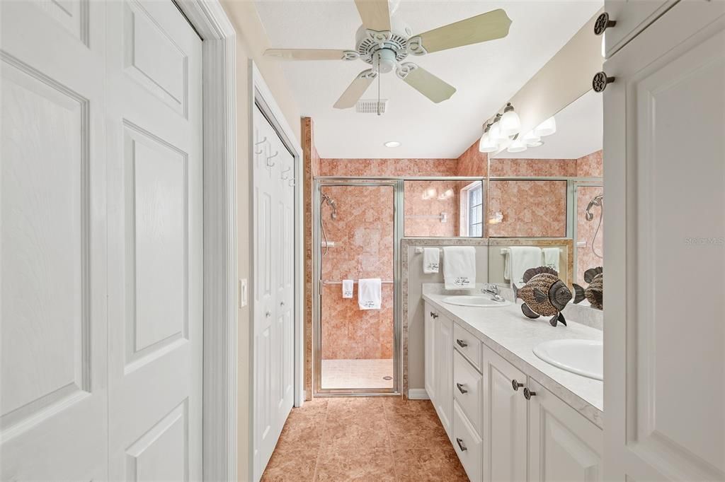 ENSUITE BATHROOM. FIRST DOOR TO LEFT IS WATER CLOSET. SECOND DOOR ON LEFT LEADS TO WALK-IN CLOSET