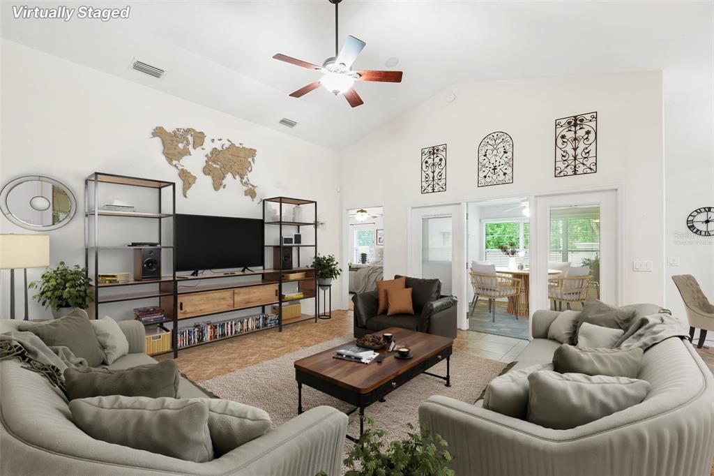 VIRTUALLY STAGED FAMILY ROOM WITH VIEW TOWARDS BONUS/FLORIDA ROOM