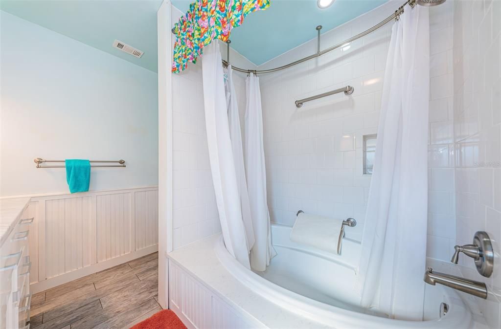Step into the tub for a refreshing shower! Enjoy the best of both worlds as you relax in the comfort of warm water. It's a simple pleasure that makes every day a little brighter.