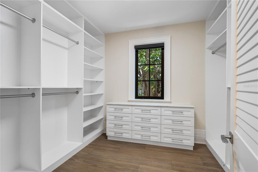 Two custom-fitted walk-in closets, offering unparalleled elegance and organization.