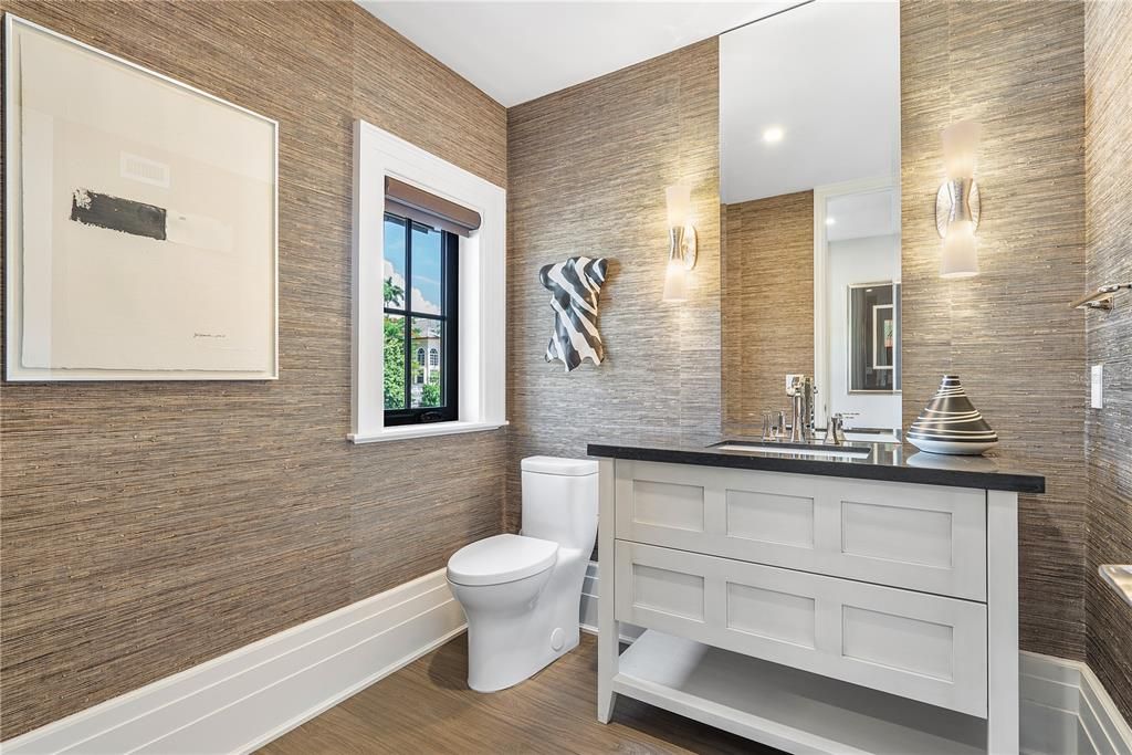 Lavishly appointed powder room on the first floor, offering an elegant retreat for guests.