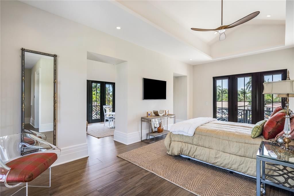 Elevate your living experience to new heights in the upstairs primary bedroom, featuring a generous sitting room and breakfast bar—a haven of refinement that effortlessly doubles as a second-floor primary retreat