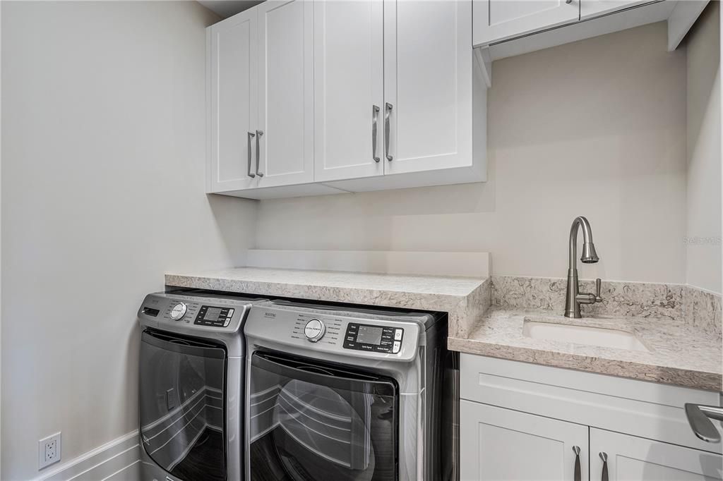 Experience elevated convenience with an upstairs laundry room, providing practicality for effortless living.