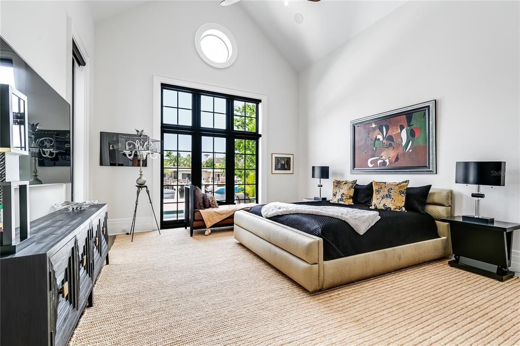 First-floor primary bedroom, offering custom-fitted walk-in closets, a breakfast bar.