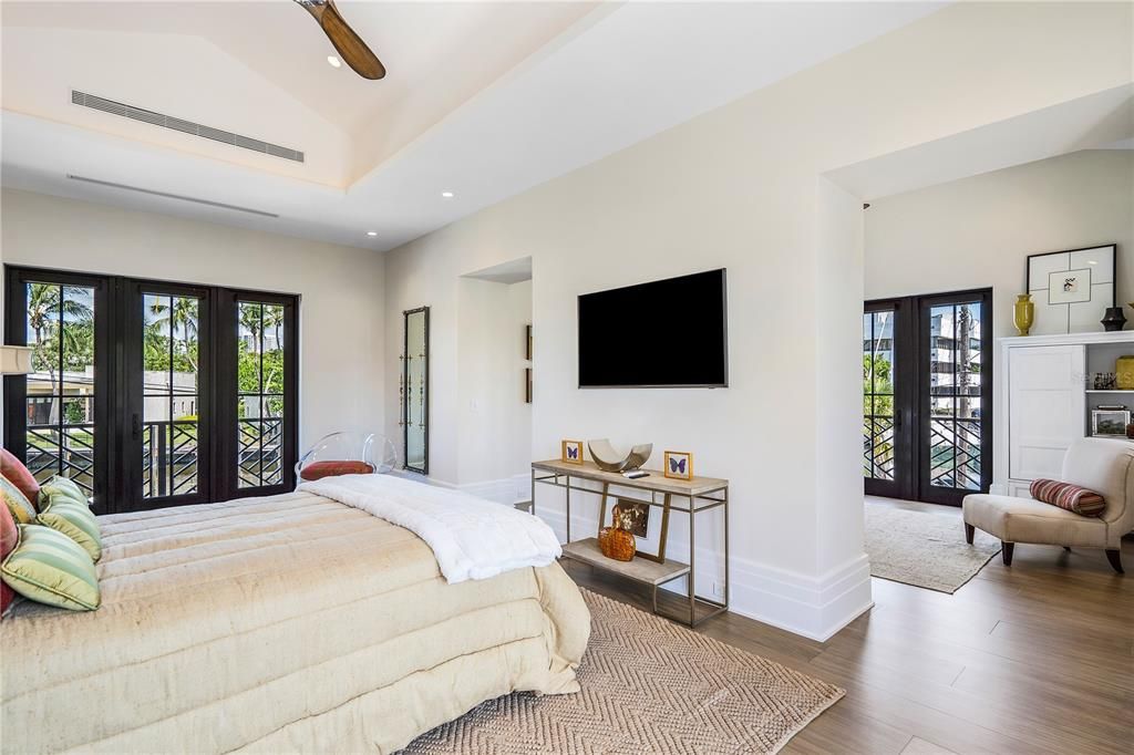 Elevate your living experience to new heights in the upstairs primary bedroom, featuring a generous sitting room and breakfast bar—a haven of refinement that effortlessly doubles as a second-floor primary retreat