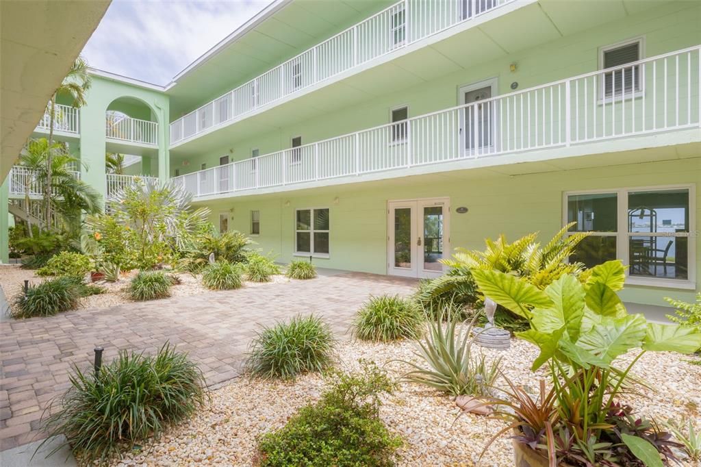 Gorgeous plant-filled courtyard to welcome you home!