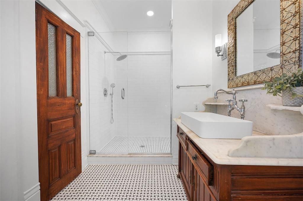Spacious walk in shower and linen closet