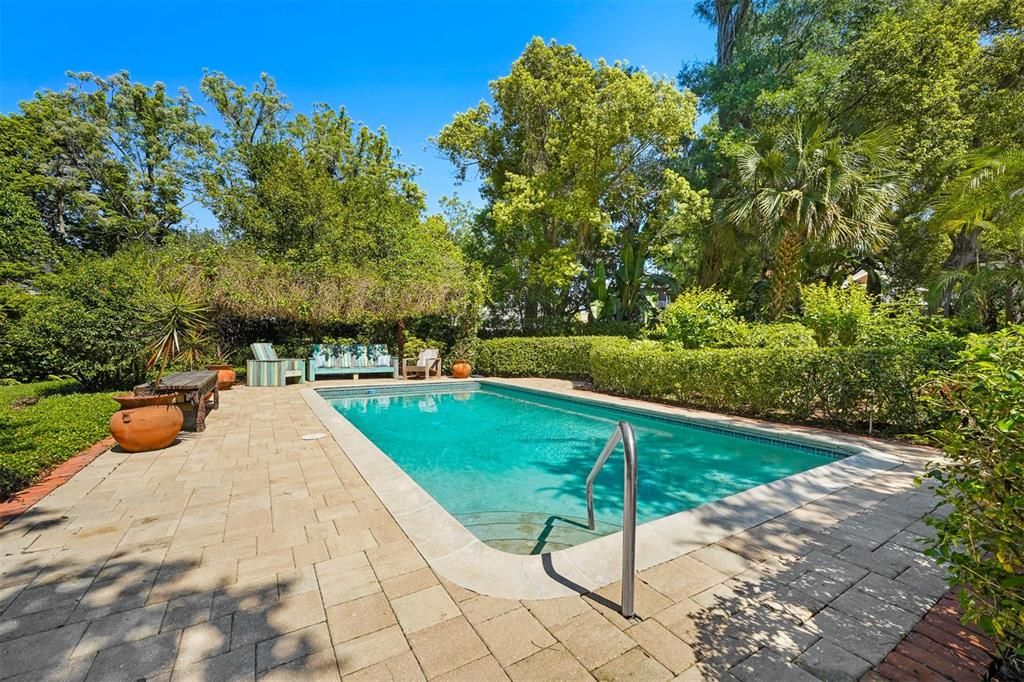 Pool surrounded by lush landscaping ... It's truly a backyard paradise
