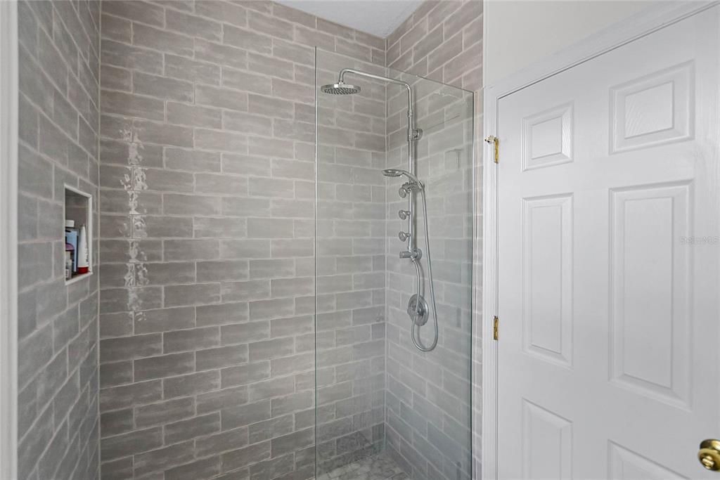 Shower in Upstairs Bath separated from space with double sinks
