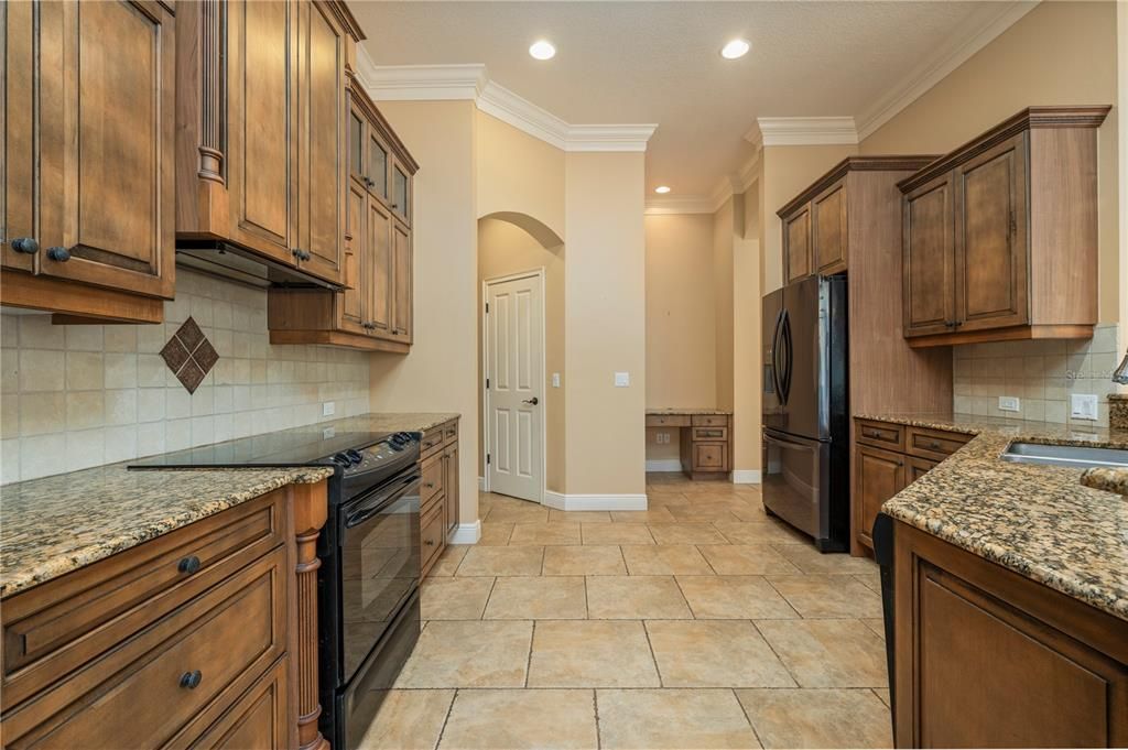 Kitchen leading to laundry and garage.