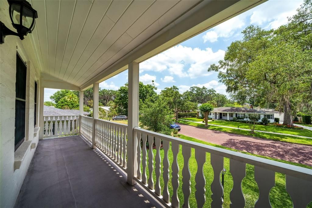 Upstairs balcony with original rail.