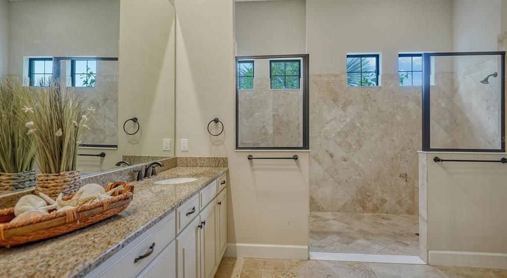 Primary bathroom with enclosed toilet ara linen closet