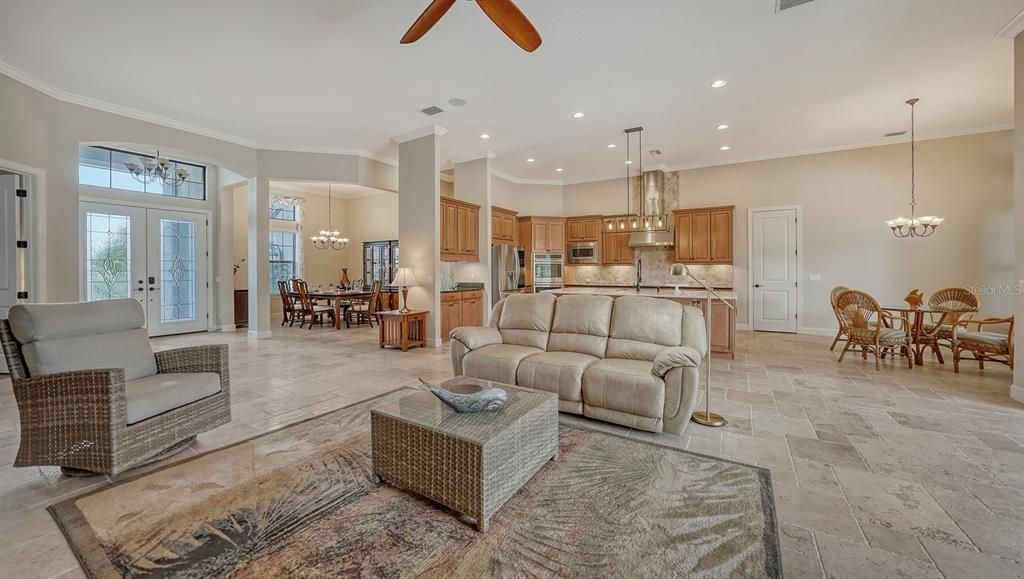 Neutral elements enhance the timeless appeal of this beautiful home.  Travertine flooring in all the main areas, including the expansive outoor lanai. This home is just waiting for your personal touches and design preferences