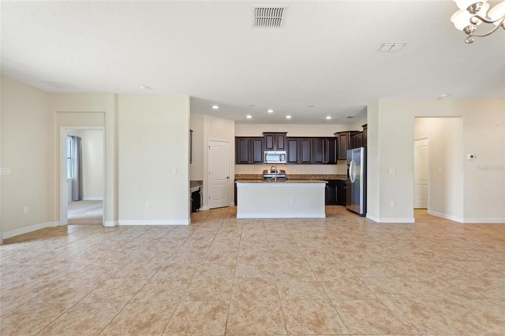 Open floor plan from family room/dining room to kitchen.