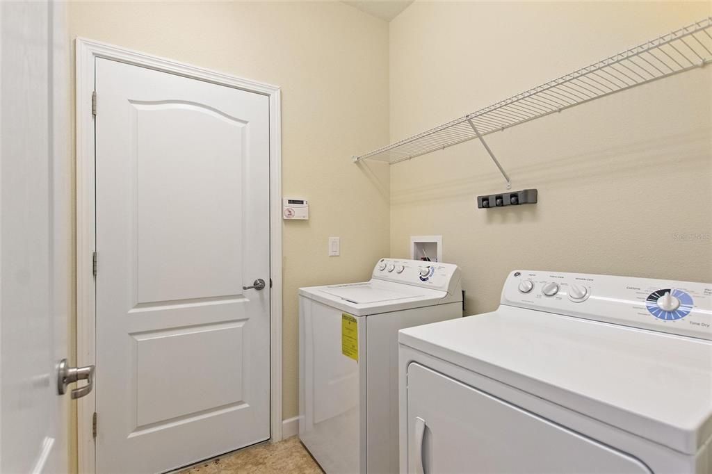 Interior laundry with washer and dryer.