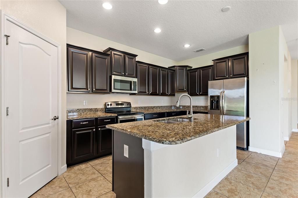 Beautiful kitchen with granite countertops and stainless steel appliances.
