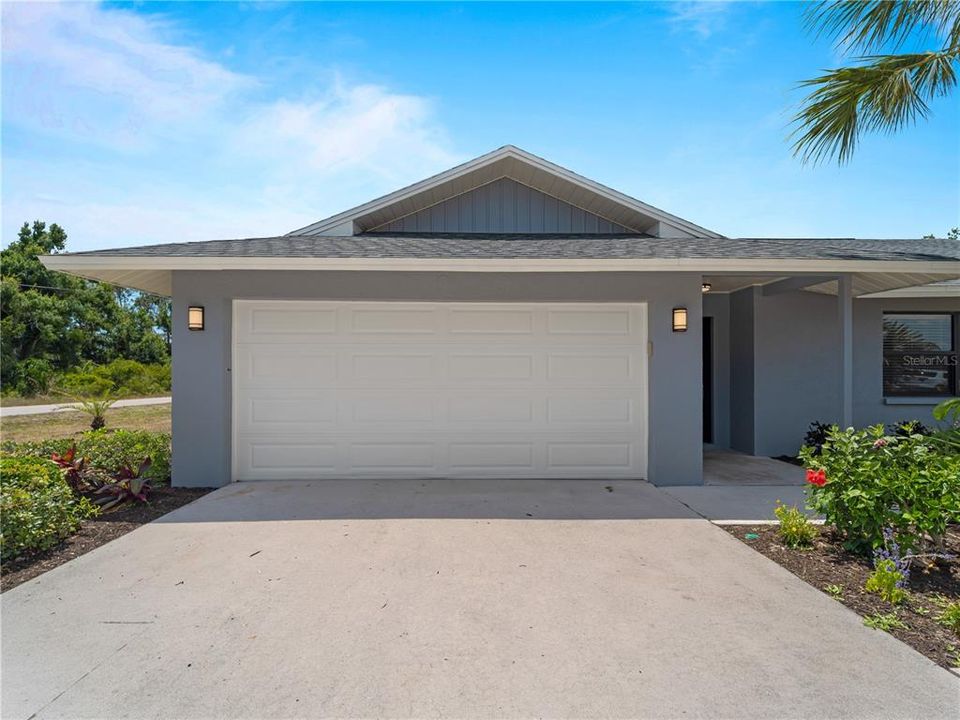 Front of house - Freshly painted exterior color coordinated with 2023 installed roof.