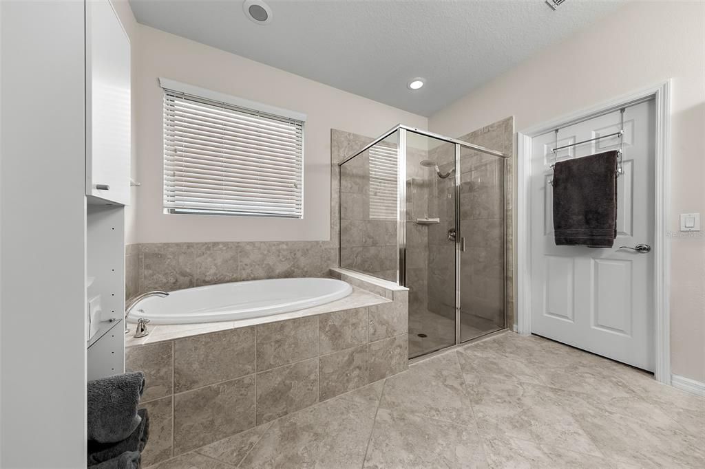 soaking tub and large shower
