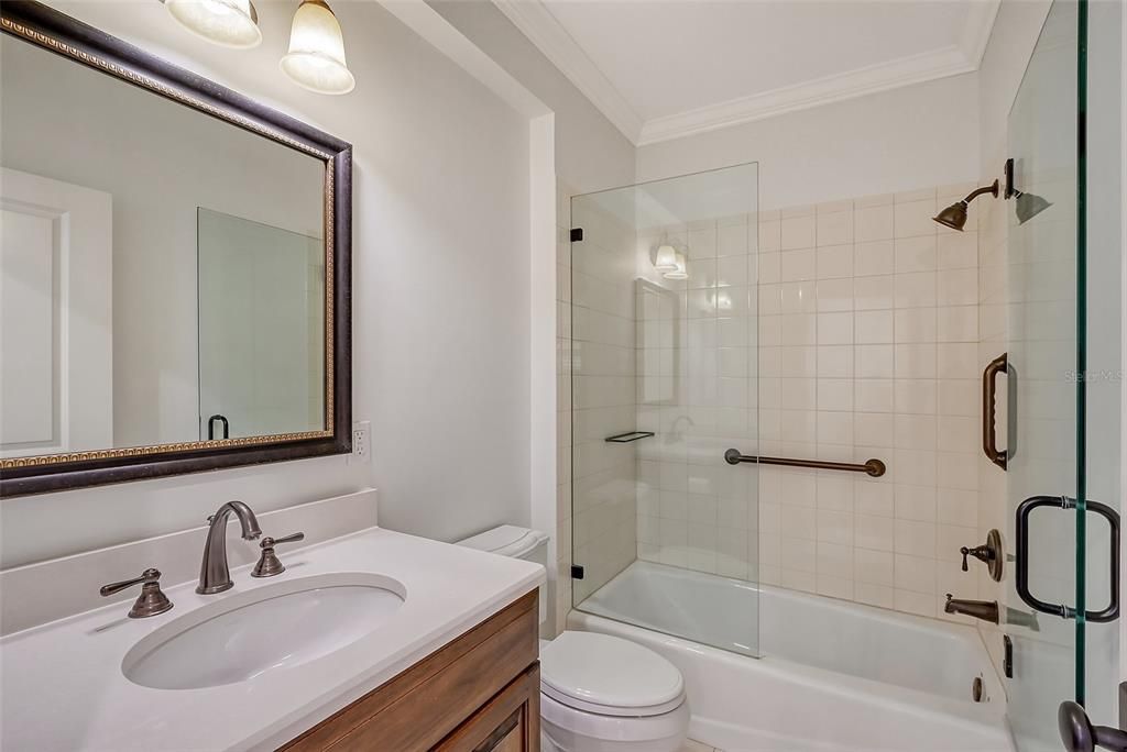 guest bathroom with tub/shower combo