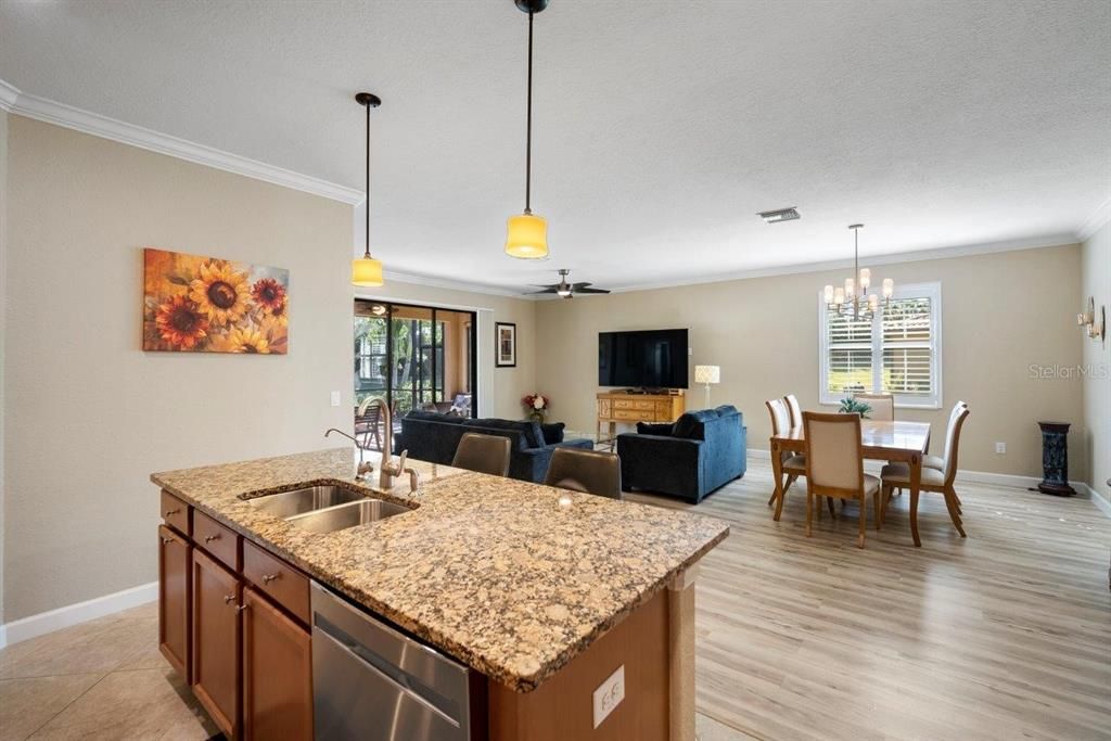 Stunning Kitchen featuring a large island, granite countertops, stainless steel appliances, and a pantry.