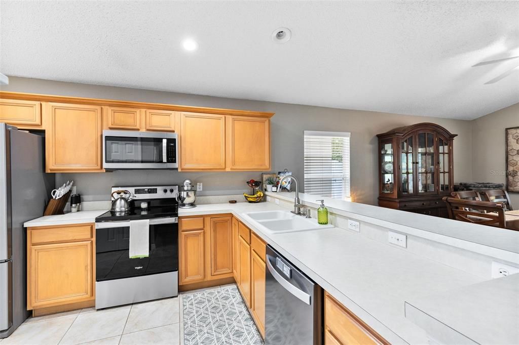 Stainless steel appliances in the spacious kitchen