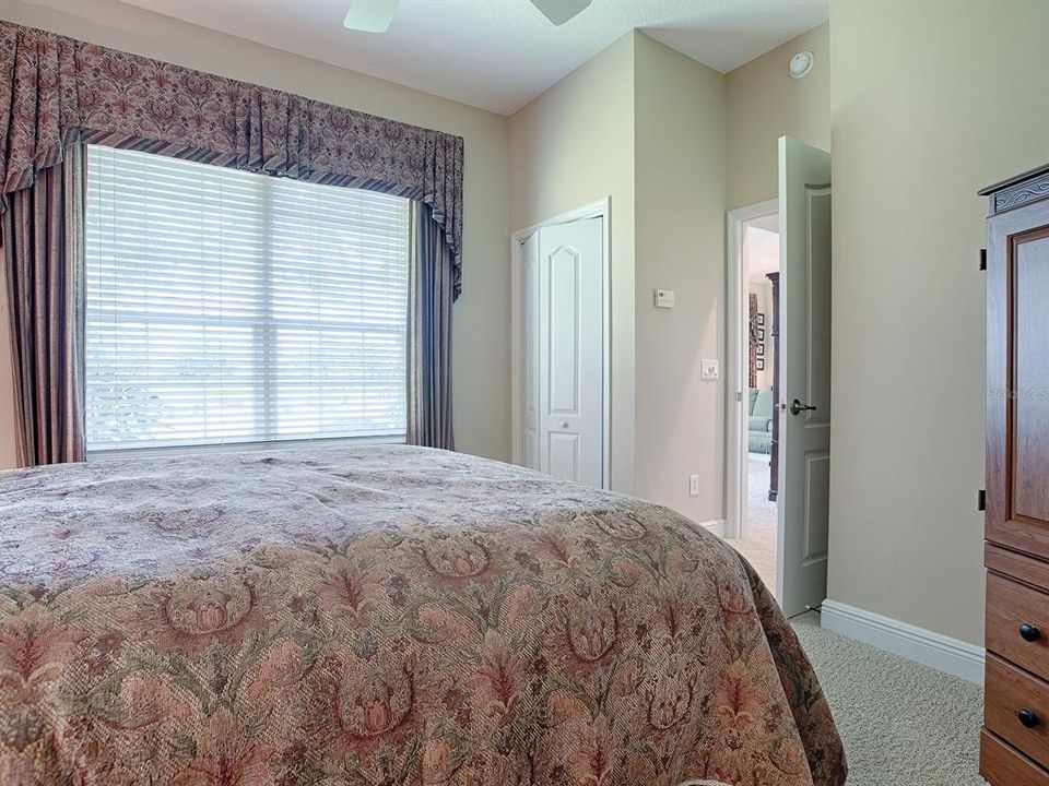 THIS BEDROOM OPENS OUT TO THE HALLWAY AND FAMILY ROOM AND THE BATH IS AROUND THE CORNER.