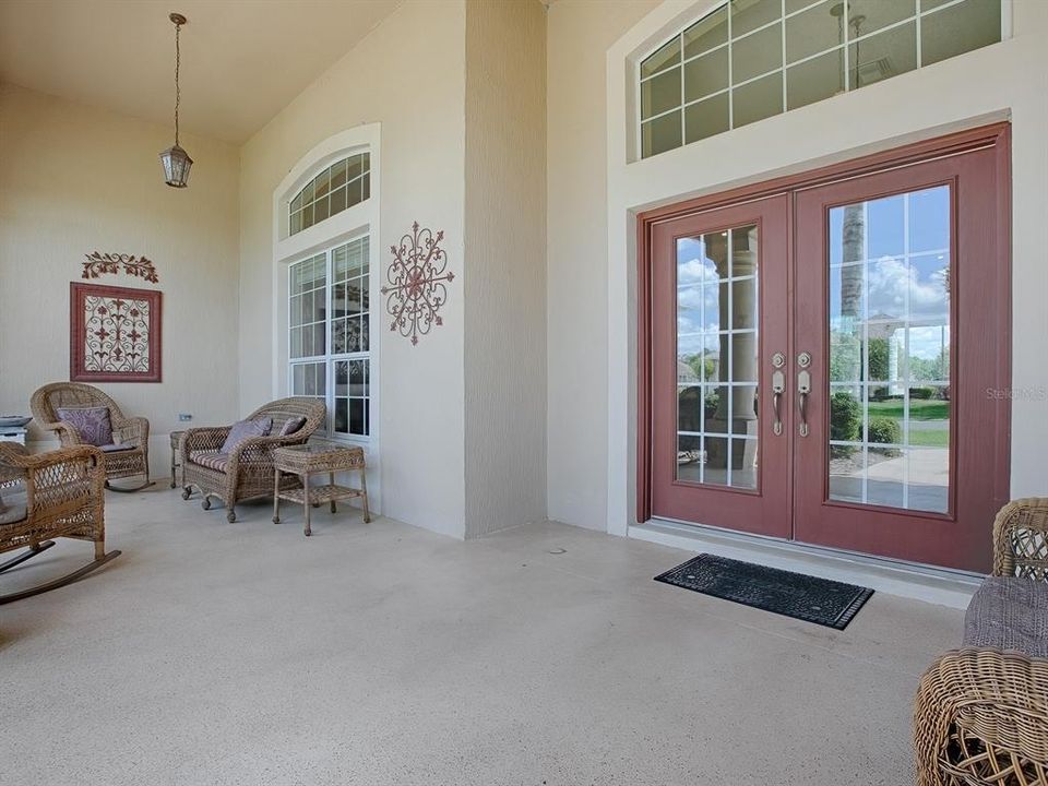 GRAND DOUBLE DOOR ENTRANCE WITH LARGE FRONT PORCH.