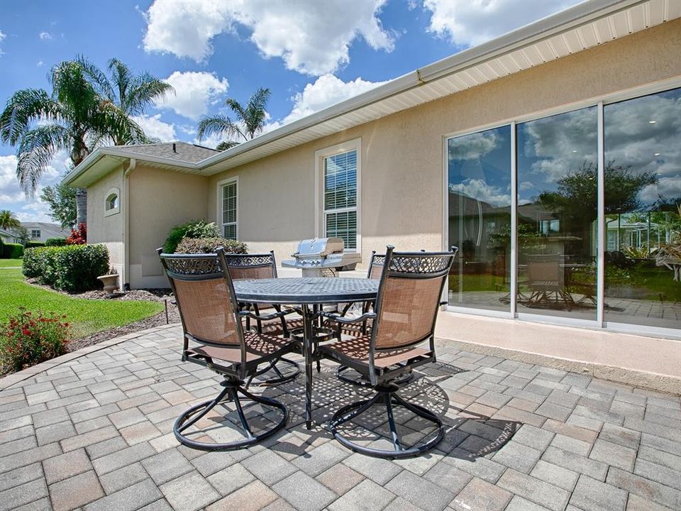 AND OUTSIDE FROM THE FLORIDA ROOM IS A PAVERED PATIO - GREAT FOR GRILLING.