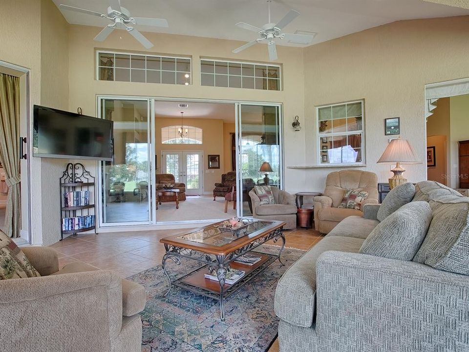 TRANSOM FOR MORE NATURAL LIGHT INTO THE LIVING ROOM AND THE PASS-THRU WINDOW TO THE KITCHEN.