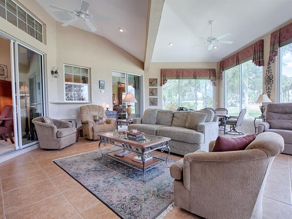 STEP OUT INTO THE FLORIDA ROOM FROM THE KITCHEN ON THE RIGHT SLIDING GLASS DOORS OR TO THE LEFT FROM THE LIVING ROOM.
