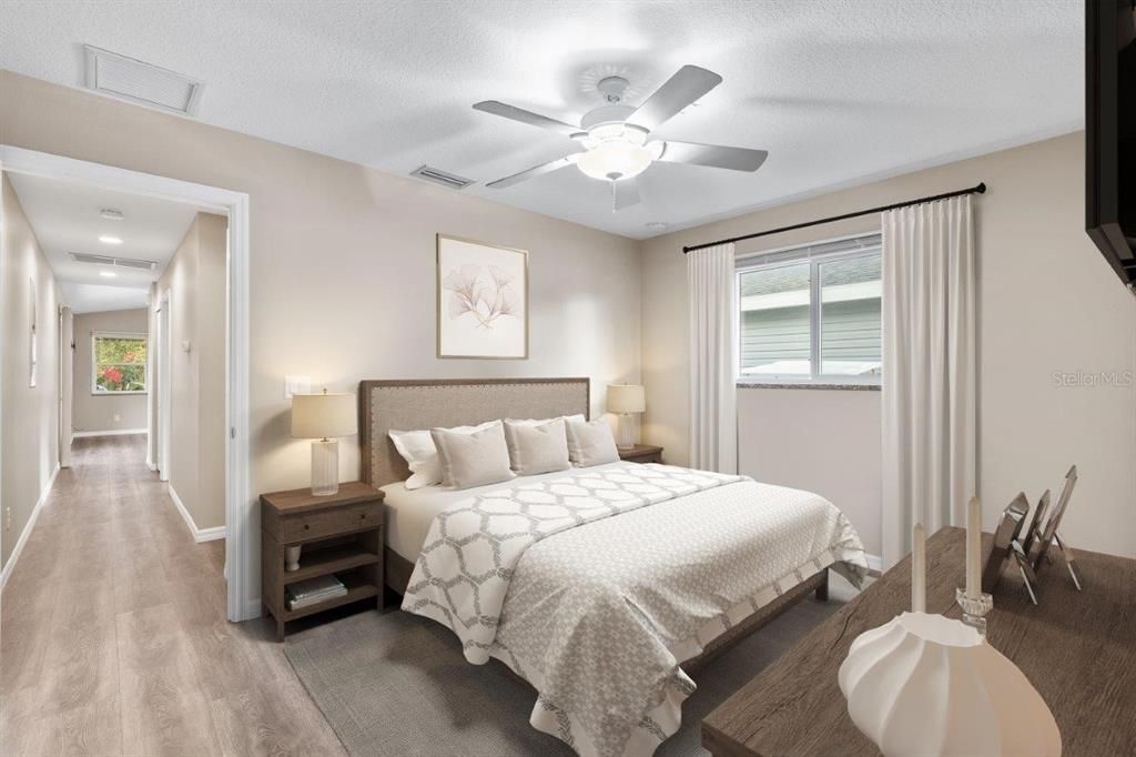 Owners Suite featuring a walk-in closet and ensuite bathroom. *Photo of 3857 Almond Ave, Sarasota, FL 34234*