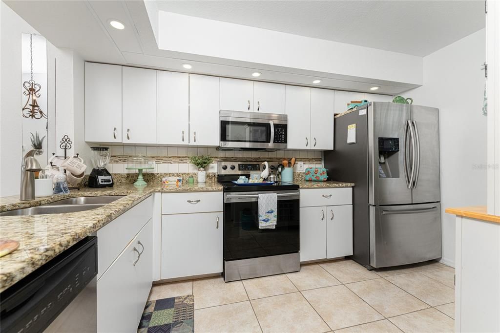 Updated kitchen with stainless steel appliances.