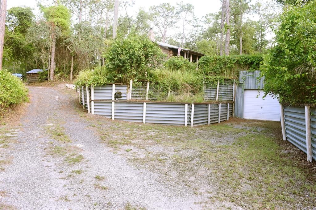 Driveway has detached garage/workshop