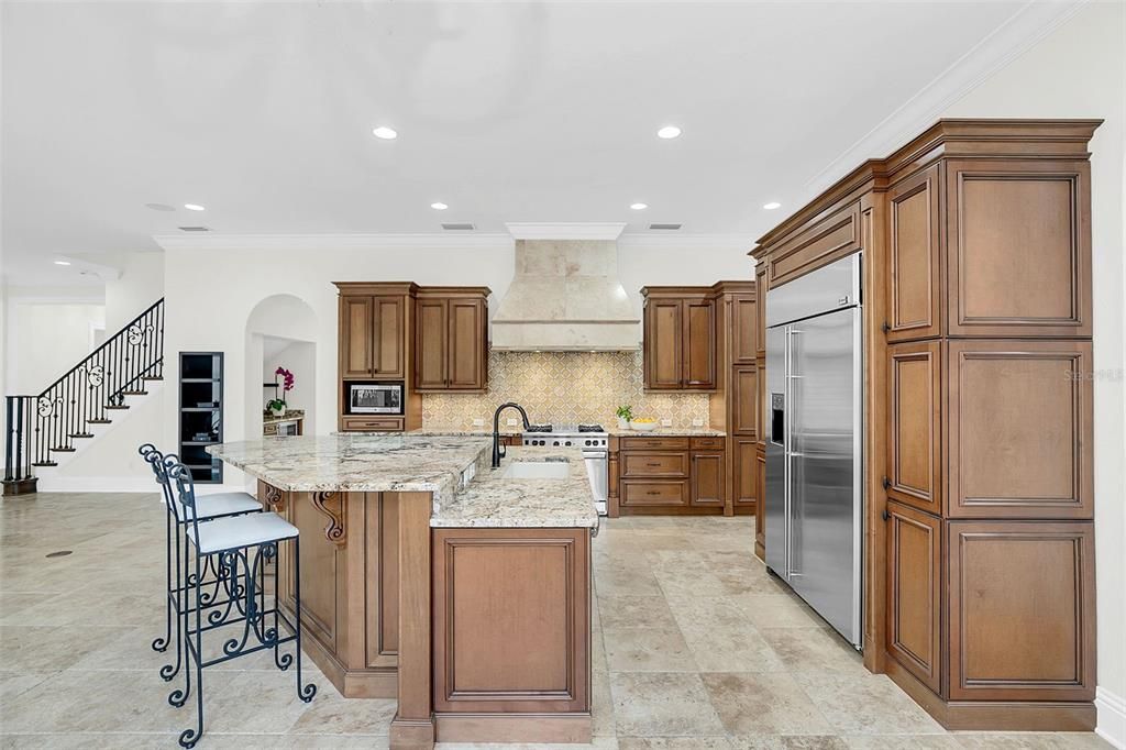 Stunning kitchen, ideal for cooking and hosting. *Note the custom-made wrought iron