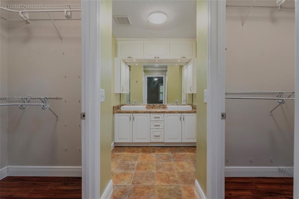 ENTRY TO PRIMARY BATHROOM AND TWO WALK IN CLOSETS