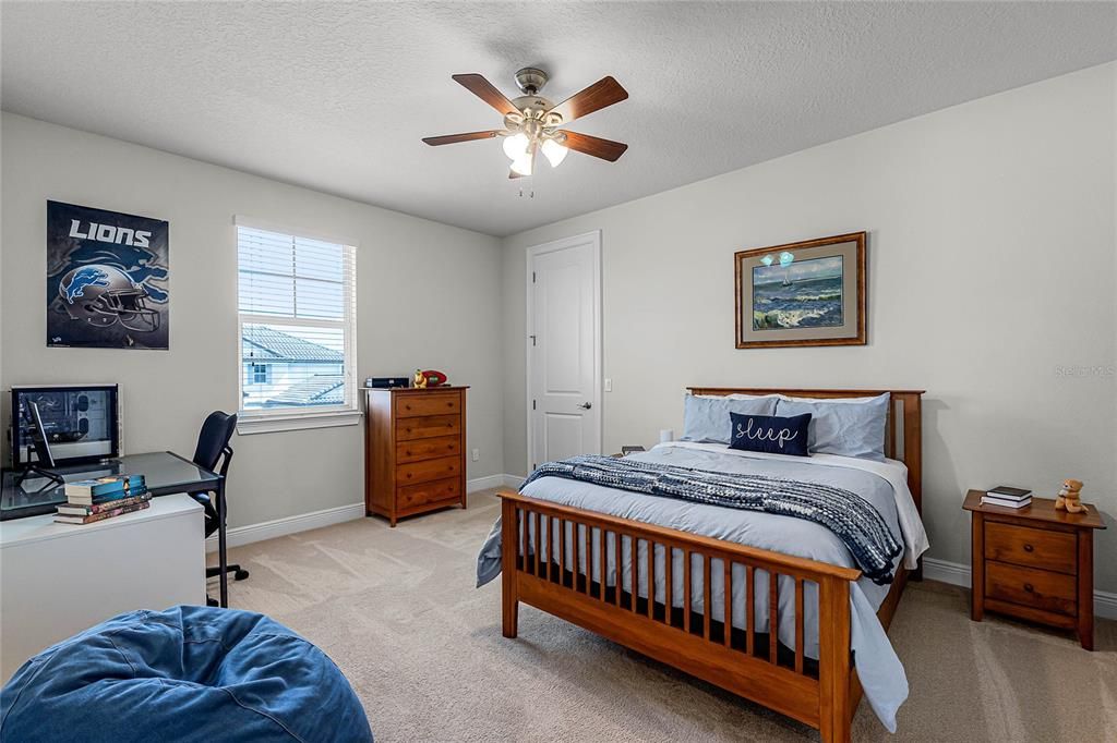 fourth bedroom with ceiling fan