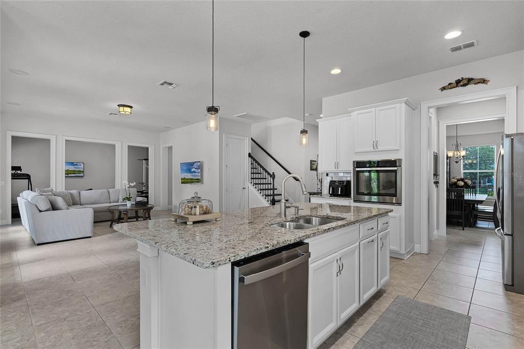 featuring granite countertops, stainless steel appliances