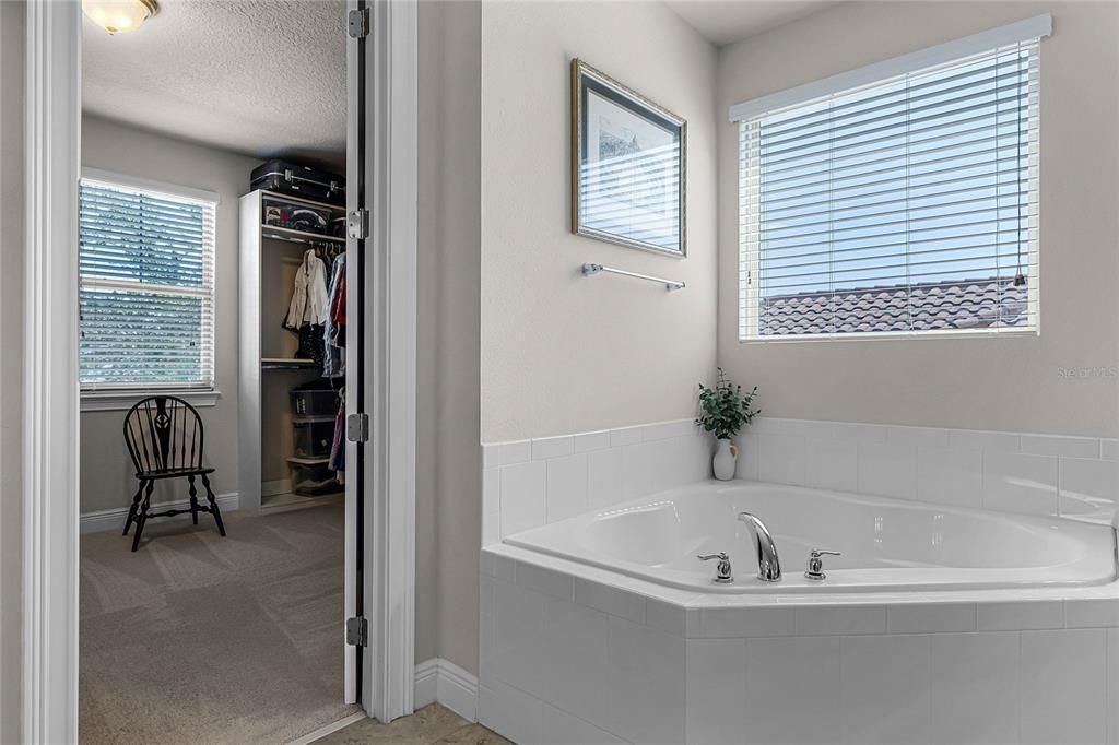 soaking tub with easy access to the walk in closet