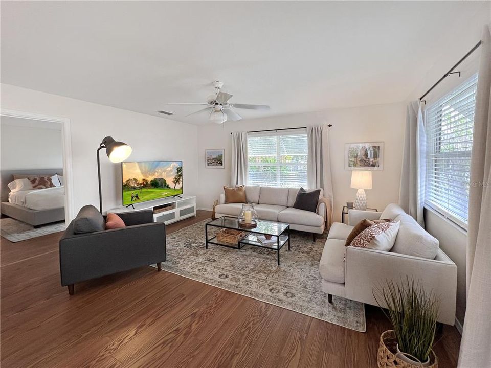 Bright and airy Living Room with all the comforts of home and featuring a 65" Smart TV, ready for your streaming of your favorite shows and movies.