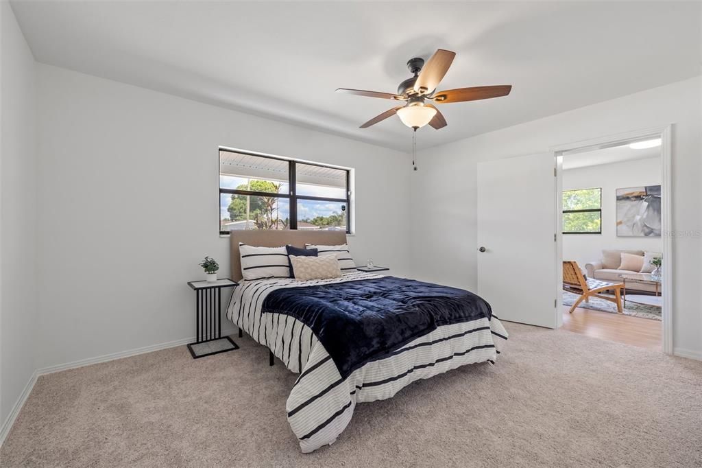 Spacious primary bedroom with brand new carpet!