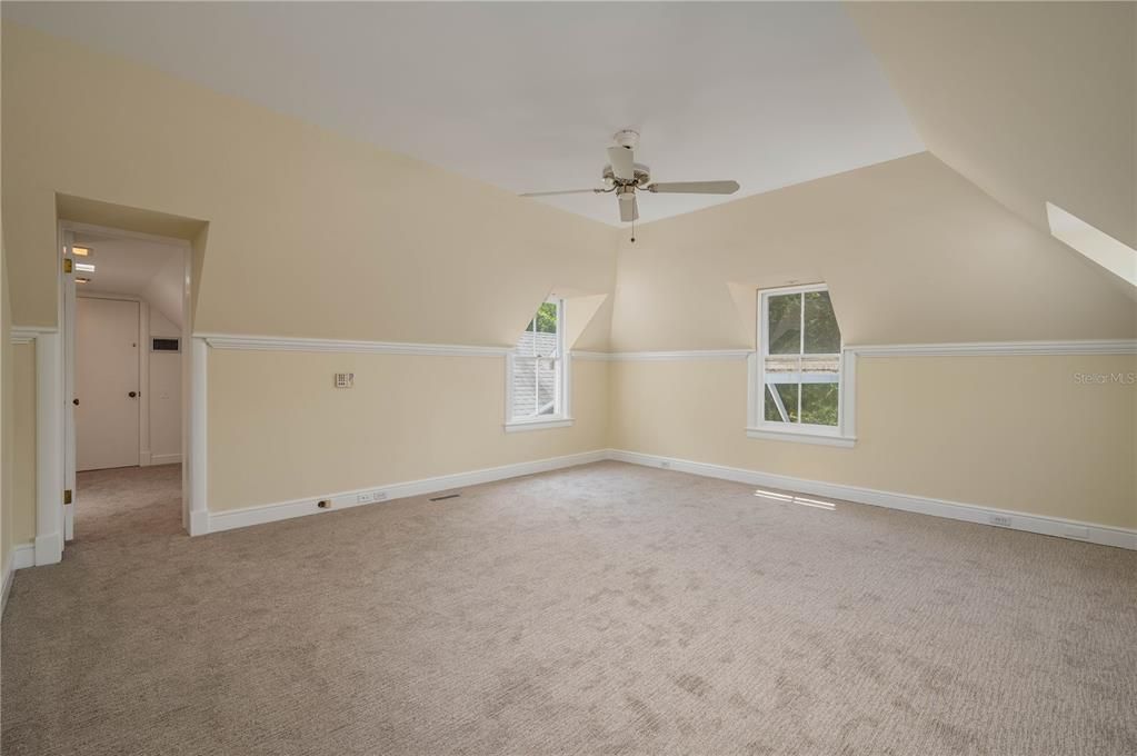 Large Bedroom looks out over Patio, with large walk-in closets on either side