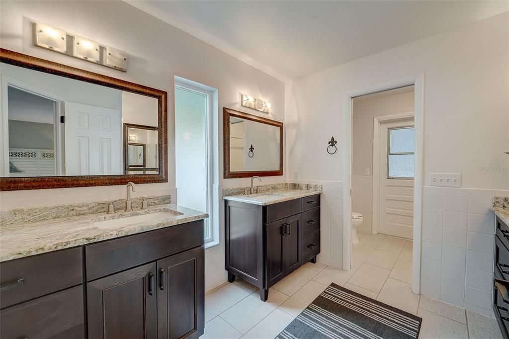 Dual vanities with quartz countertops